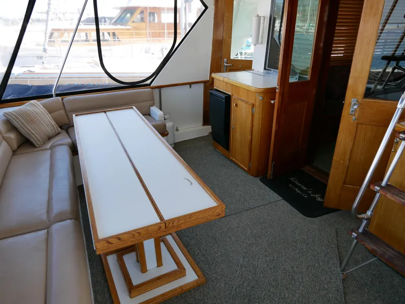 Slide: The Image of Interior of 1978 Hatteras 58 Cockpit Motor Yacht with seating and table. - 41