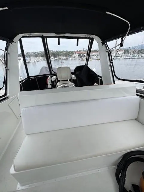 Slide: The Image of Interior view of 1978 Hatteras 58 Cockpit Motor Yacht with seating and helm. - 47