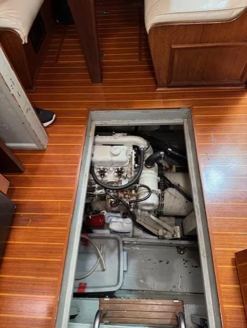Slide: The Image of Engine compartment of a 1978 Hatteras 58 Cockpit Motor Yacht with wooden flooring. - 9