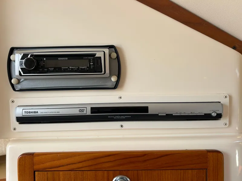 Slide: The Image of Kenwood stereo and Toshiba DVD player in 2007 Grady-White Express 305 boat interior. - 20