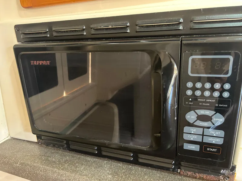 Slide: The Image of Tappan microwave in 2007 Grady-White Express 305 boat kitchen. - 21