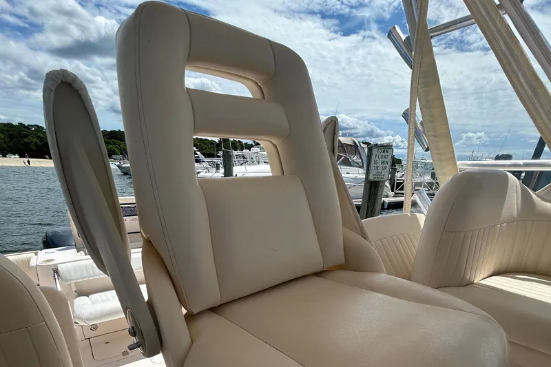 Slide: The Image of 2007 Grady-White Express 305 boat seat with marina background. - 26