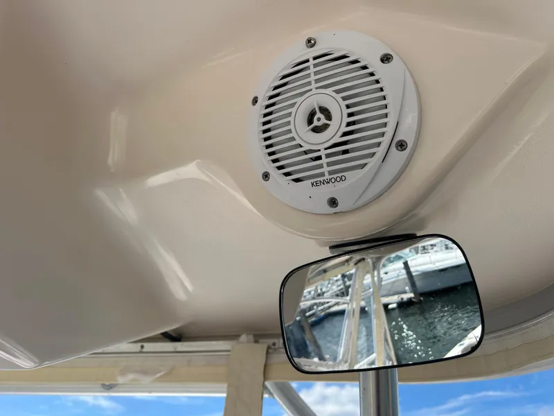 Slide: The Image of Kenwood speaker and mirror on 2007 Grady-White Express 305 boat interior. - 34