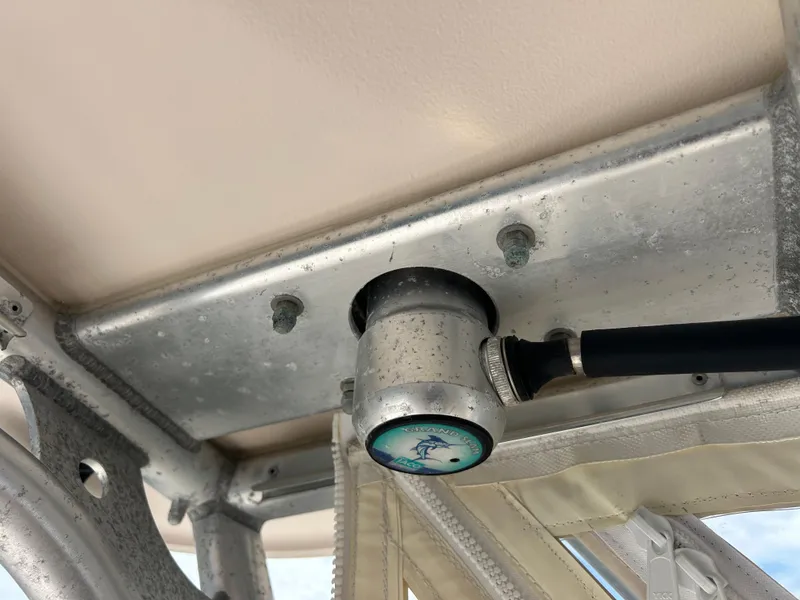 Slide: The Image of Close-up of a 2007 Grady-White Express 305 boat's metal fixture and cable connection. - 35