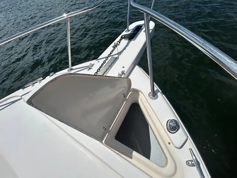 Slide: The Image of 2007 Grady-White Express 305 boat bow with anchor chain on water. - 42