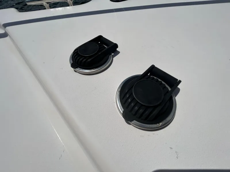 Slide: The Image of 2007 Grady-White Express 305 boat deck with two black fittings. - 44