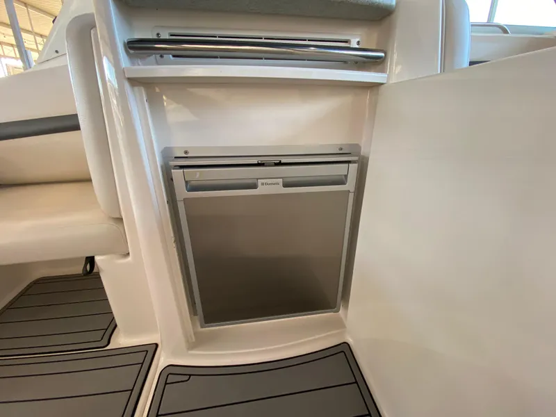 Slide: The Image of 2004 Chaparral Signature 330 interior with built-in mini fridge. - 10