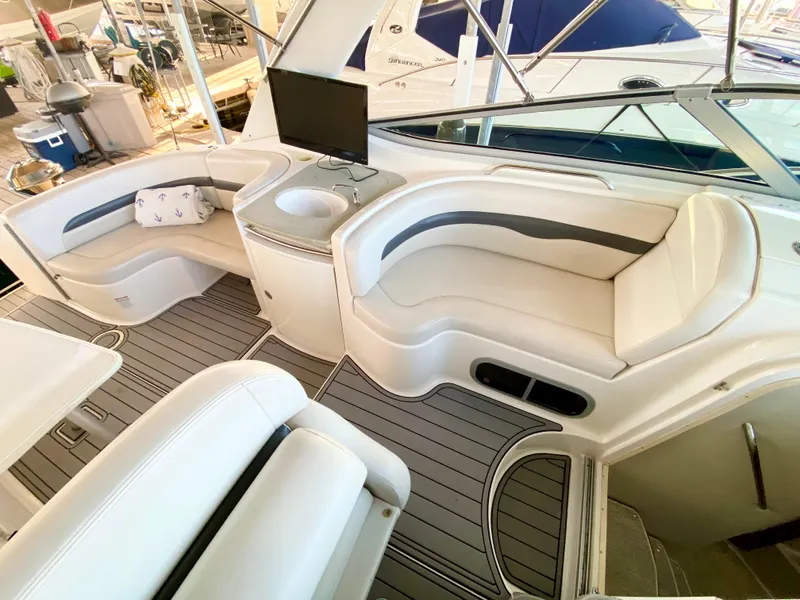 Slide: The Image of Interior of 2004 Chaparral Signature 330 yacht with plush seating and modern amenities. - 11