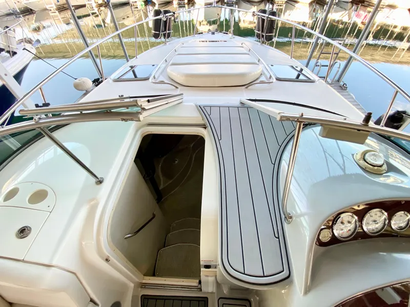 Slide: The Image of 2004 Chaparral Signature 330 yacht deck with open cabin entrance and sleek design. - 12