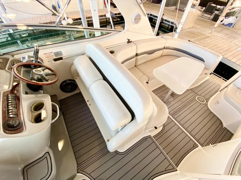 Slide: The Image of 2004 Chaparral Signature 330 boat interior with seating and steering wheel. - 14