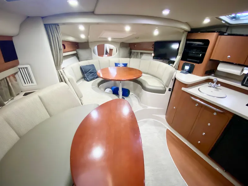 Slide: The Image of Luxurious interior of 2004 Chaparral Signature 330 yacht with elegant seating and modern amenities. - 15