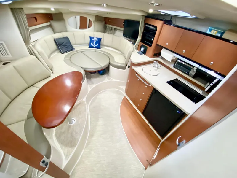 Slide: The Image of Luxurious 2004 Chaparral Signature 330 yacht interior with modern kitchen and cozy seating area. - 16