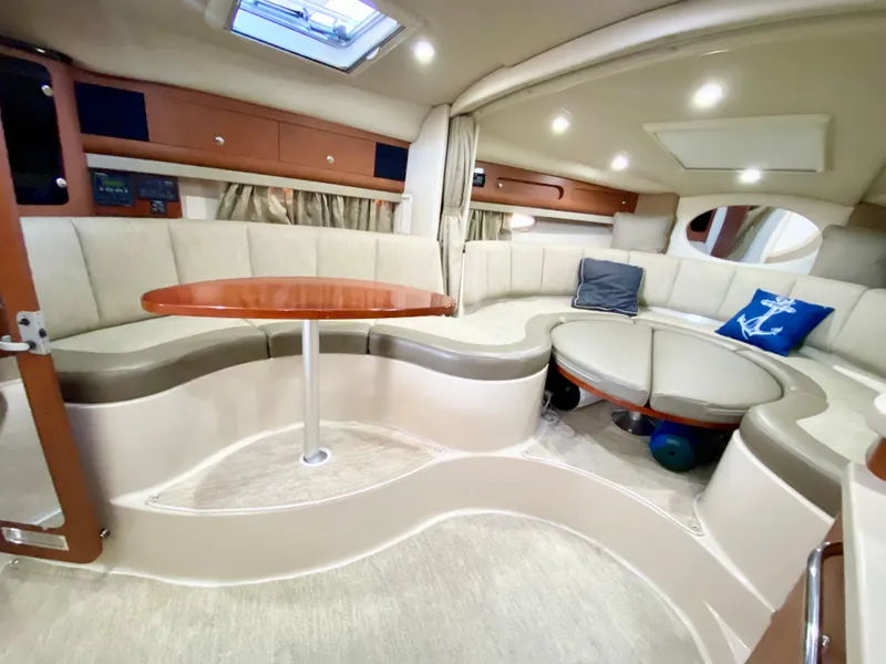Slide: The Image of Luxurious interior of 2004 Chaparral Signature 330 yacht with plush seating and elegant design. - 17