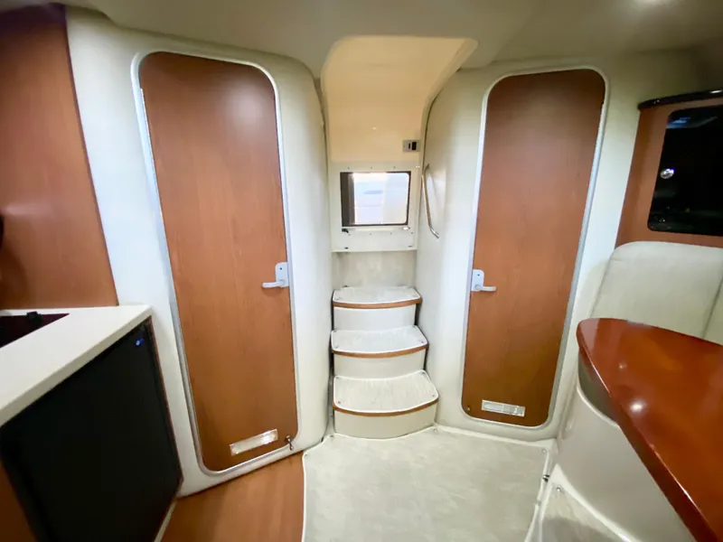 Slide: The Image of 2004 Chaparral Signature 330 interior with wooden doors and steps. - 20