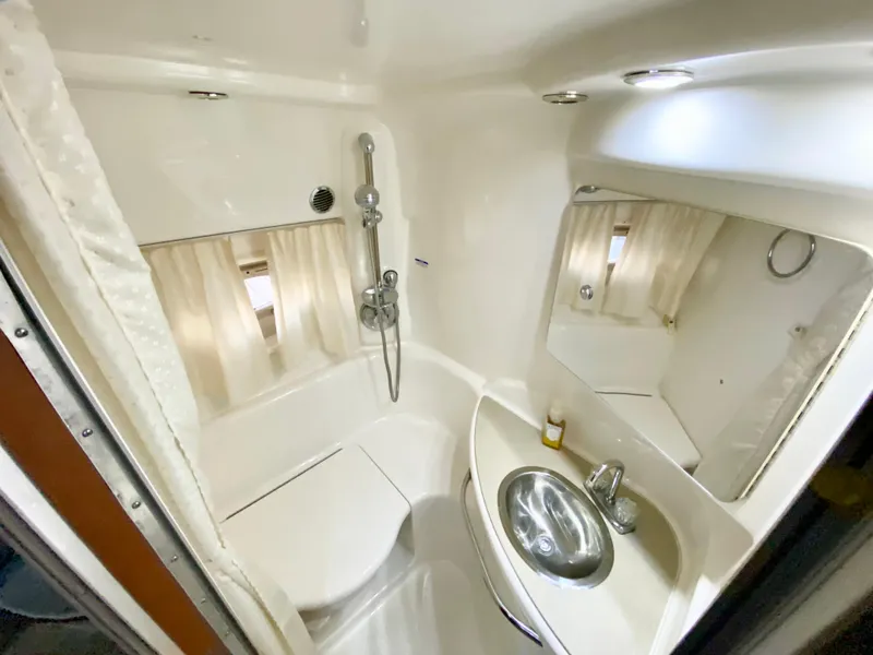 Slide: The Image of 2004 Chaparral Signature 330 bathroom with shower, sink, and mirror. - 22