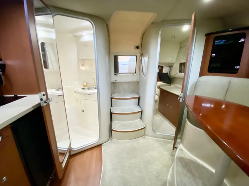 Slide: The Image of Interior of 2004 Chaparral Signature 330 yacht, featuring modern design and cozy living space. - 24
