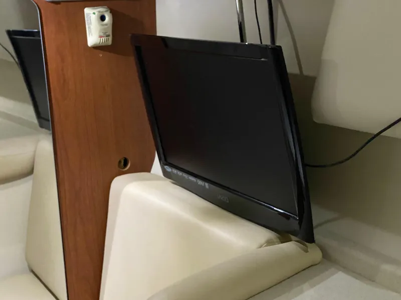 Slide: The Image of 2004 Chaparral Signature 330 interior with mounted flat-screen TV. - 29