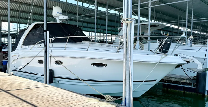Slide: The Image of 2004 Chaparral Signature 330 yacht docked in a covered marina. - 3