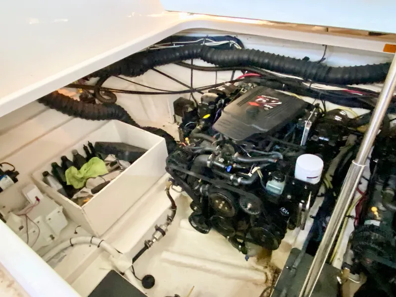 Slide: The Image of Engine compartment of 2004 Chaparral Signature 330 boat, showcasing mechanical components. - 30