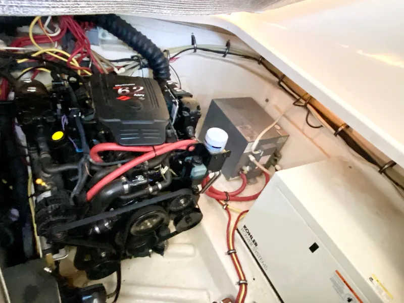 Slide: The Image of Engine compartment of 2004 Chaparral Signature 330 boat with visible wiring and components. - 33