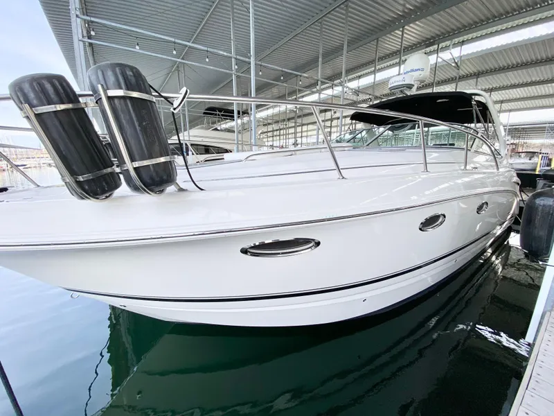 Slide: The Image of 2004 Chaparral Signature 330 boat docked in a marina, side view. - 37