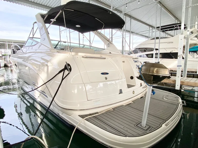 Slide: The Image of 2004 Chaparral Signature 330 yacht docked in marina, rear view. - 38