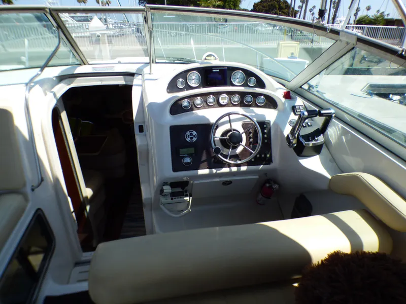 Slide: The Image of 2001 Monterey 302 Cruiser cockpit with steering wheel and control panel. - 12