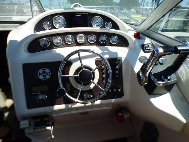 Slide: The Image of 2001 Monterey 302 Cruiser dashboard with steering wheel and control panel. - 13