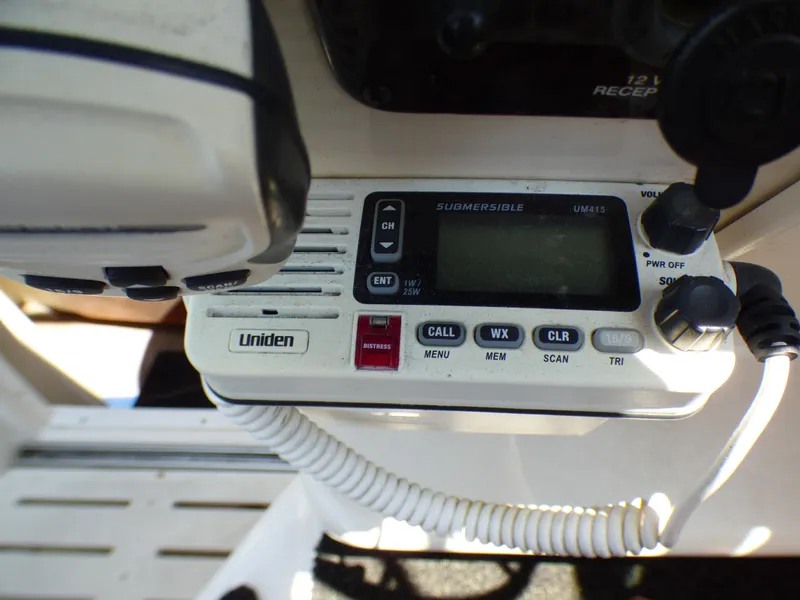 Slide: The Image of Uniden marine radio on 2001 Monterey 302 Cruiser boat dashboard. - 15