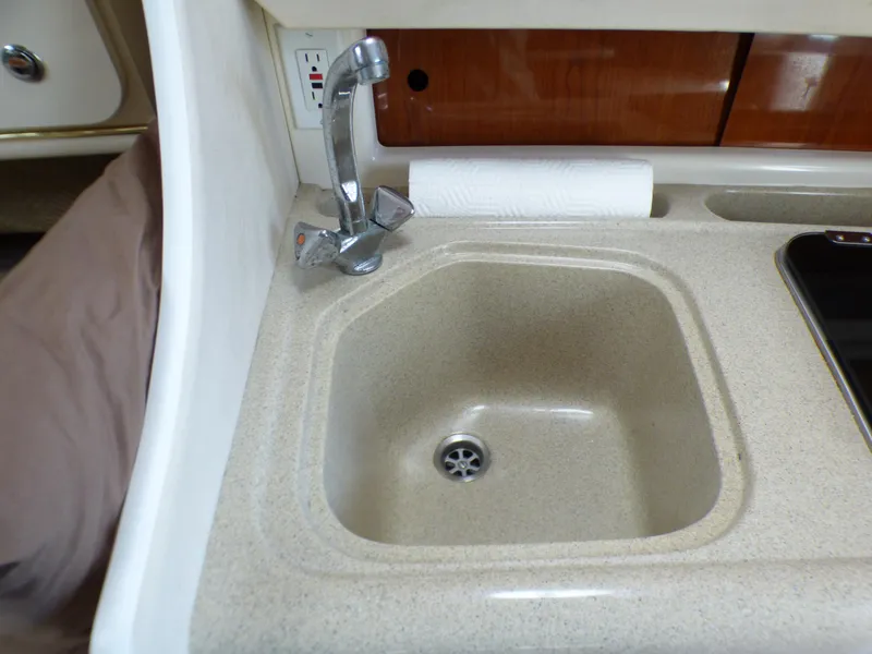 Slide: The Image of Small sink in 2001 Monterey 302 Cruiser boat interior. - 22