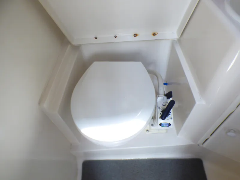 Slide: The Image of Toilet in 2001 Monterey 302 Cruiser boat bathroom, featuring compact marine design. - 27
