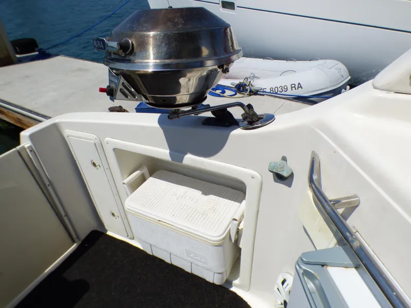 Slide: The Image of 2001 Monterey 302 Cruiser deck with grill and storage compartment. - 28