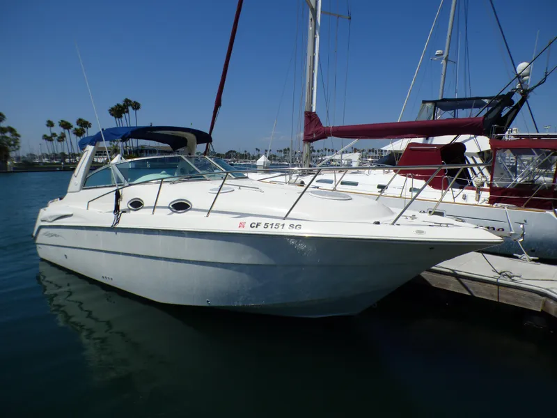 Slide: The Image of 2001 Monterey 302 Cruiser docked in a marina under clear blue skies. - 3