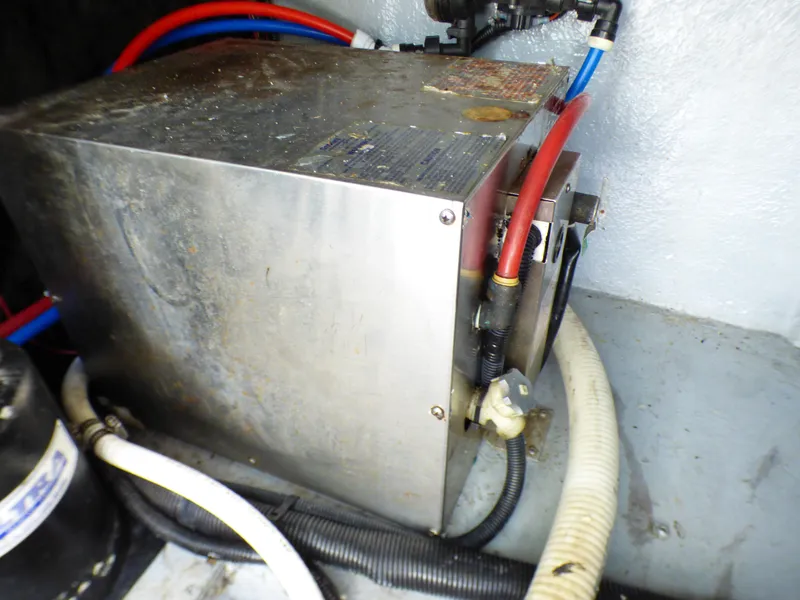 Slide: The Image of Engine compartment of 2001 Monterey 302 Cruiser with visible wiring and components. - 36