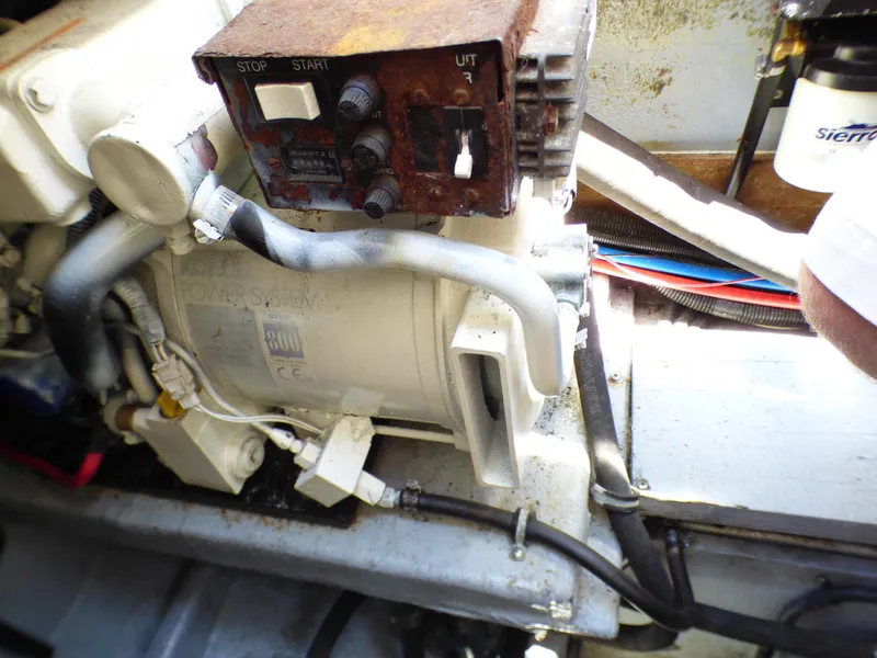 Slide: The Image of Engine compartment of a 2001 Monterey 302 Cruiser with visible wiring and components. - 38