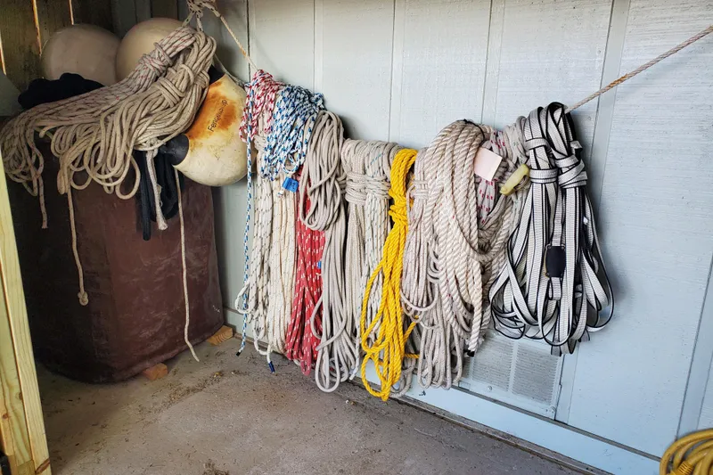 Slide: The Image of Coiled ropes and buoys stored on Island Packet 440, 2006 model. - 169