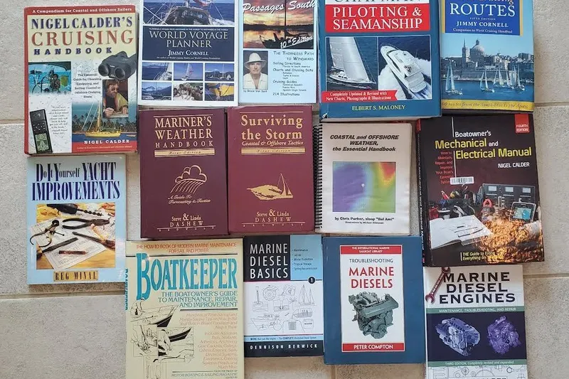 Slide: The Image of Collection of sailing and marine maintenance books, including guides on weather, seamanship, and yacht improvements. - 172