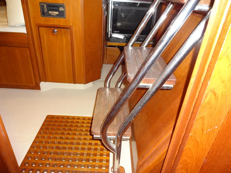 Slide: The Image of Interior of 2006 Island Packet 440 yacht with wooden steps and cabinetry. - 22