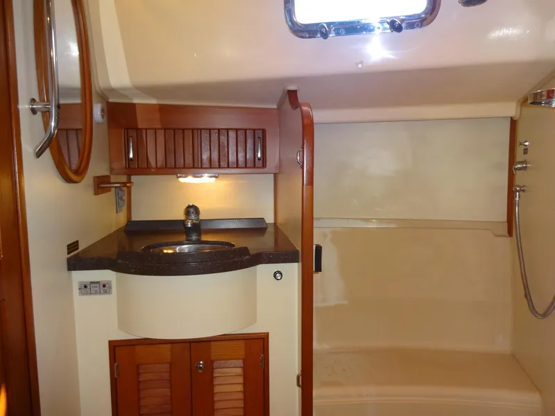 Slide: The Image of Luxurious bathroom interior of 2006 Island Packet 440 yacht with sink and shower. - 30