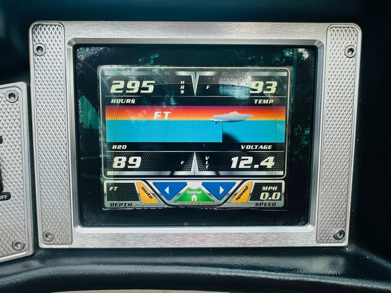 Slide: The Image of Dashboard display of a 2012 MasterCraft X-45 boat showing hours, temperature, and voltage. - 24