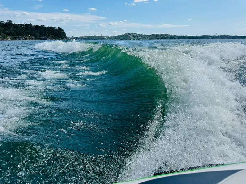 Slide: The Image of Wake created by a 2012 MasterCraft X-45 boat on a sunny lake. - 26