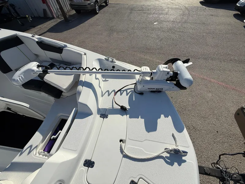 Slide: The Image of 2020 Tahoe 2150 CC boat with Minn Kota trolling motor on deck. - 17
