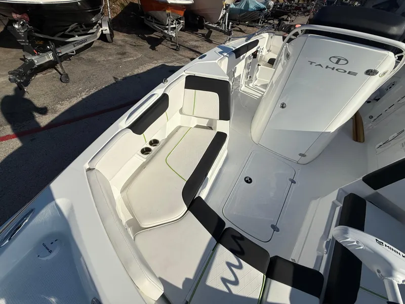 Slide: The Image of 2020 Tahoe 2150 CC boat interior with seating and storage compartments. - 21