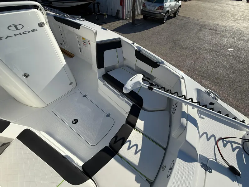 Slide: The Image of 2020 Tahoe 2150 CC boat interior with seating and storage compartments. - 22