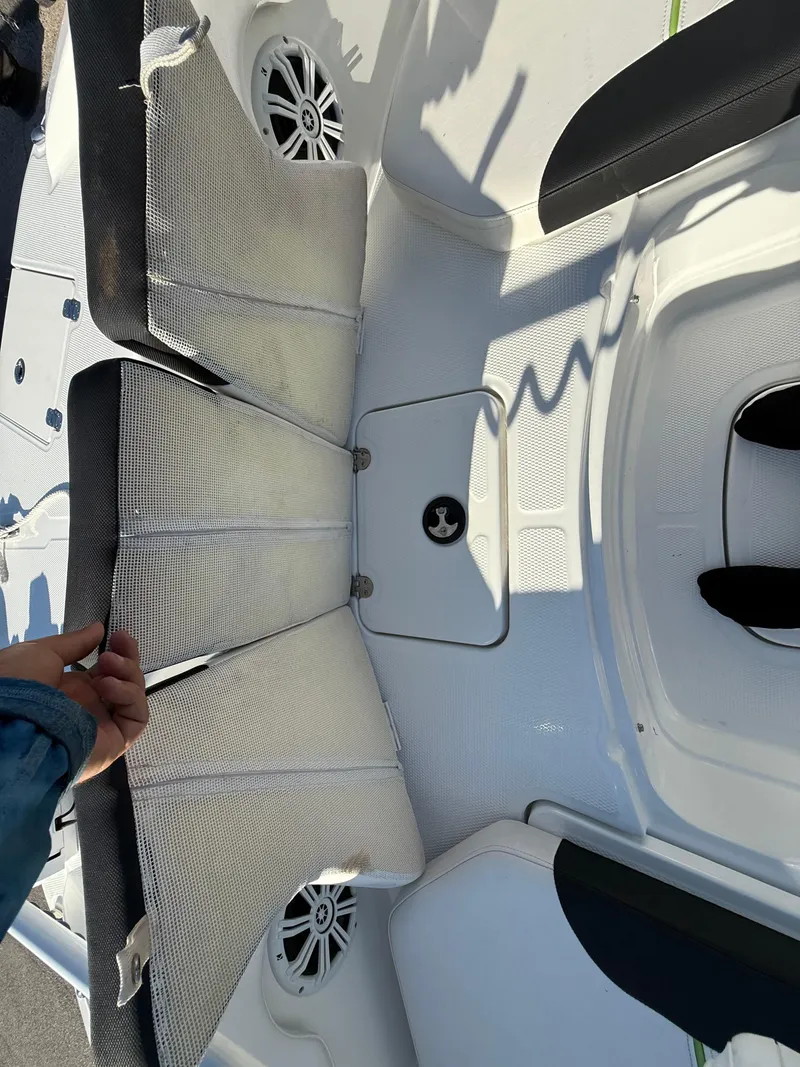 Slide: The Image of 2020 Tahoe 2150 CC boat interior with seating and speaker system. - 23