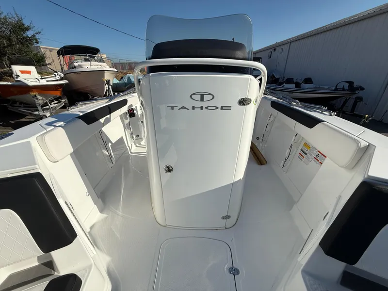 Slide: The Image of 2020 Tahoe 2150 CC boat interior, featuring sleek design and spacious seating. - 24