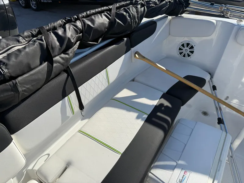 Slide: The Image of Interior of 2020 Tahoe 2150 CC boat with cushioned seating and speaker. - 40