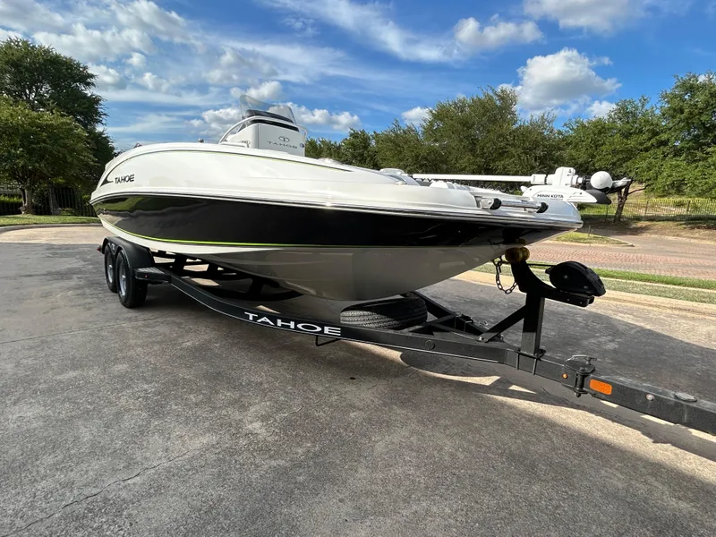 Slide: The Image of 2020 Tahoe 2150 CC boat on trailer under a blue sky. - 45