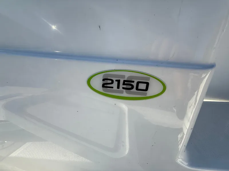 Slide: The Image of Close-up of 2020 Tahoe 2150 CC boat model emblem on white surface. - 47