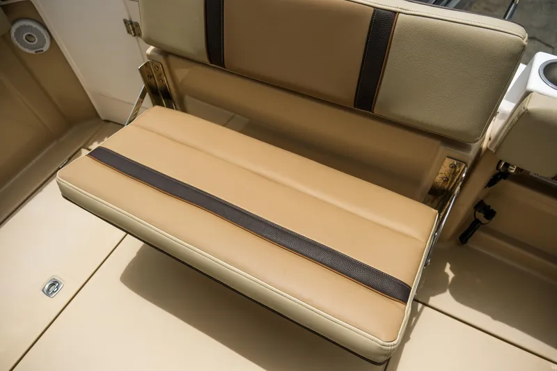 Slide: The Image of 2018 Ranger Tugs R-23 boat seat with tan and brown upholstery. - 11